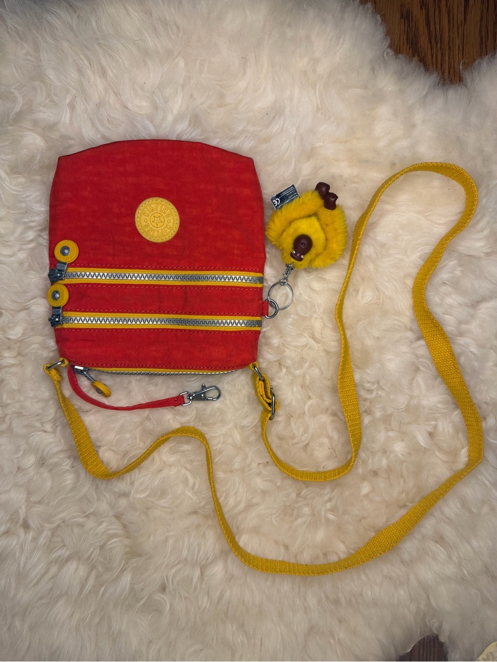Kipling Red Crossbody Bag with Yellow Strap and Gorilla Charm